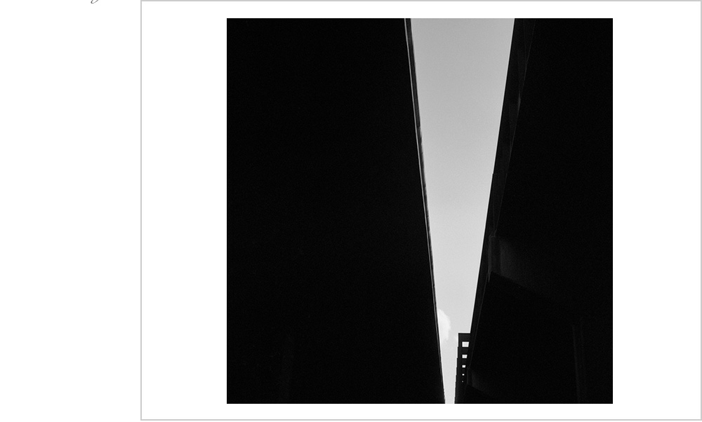 The dark and dramatic shadows beckon the viewer to enter despite the trepidation they may feel entering the unknown