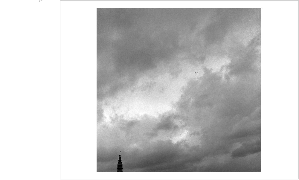 An airplane departs San Francisco with the Ferry Building in San Francisco as the only witness.