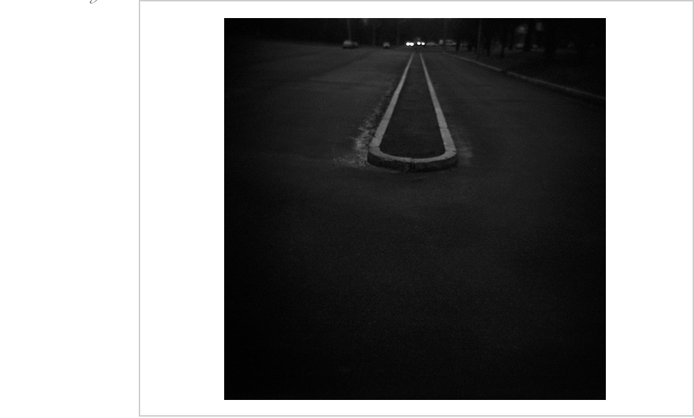 In the dawn of this Boston morning, a menacing gaze from two pairs of headlights.