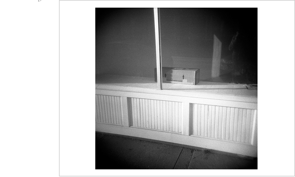 Empty storefront, some shadow, a bunch of lines. Splash of light. Bake at 350.