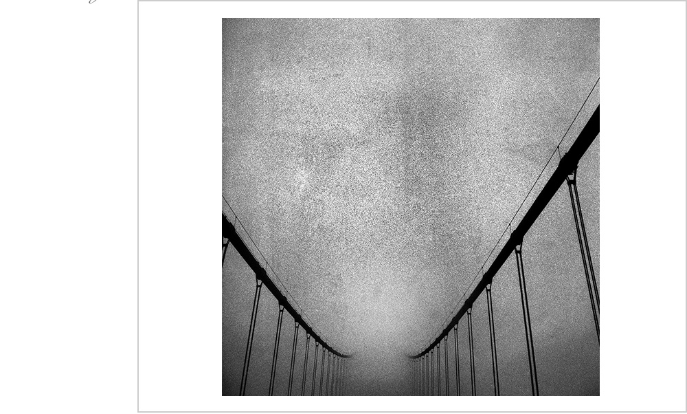 The famous fog of San Francisco obsures a slightly more famous landmark, the Golden Gate Bridge