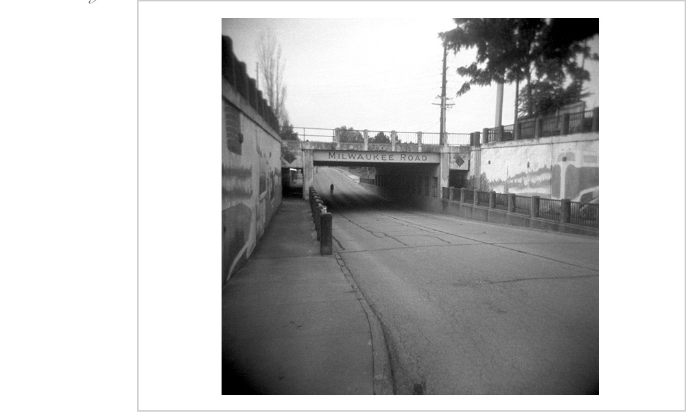 A lone rider makes their way under the Milwaukee Road train trestle in Iowa on the annual great bike ride acros Iowa that is known to all as R.A.G.B.R.A.I.