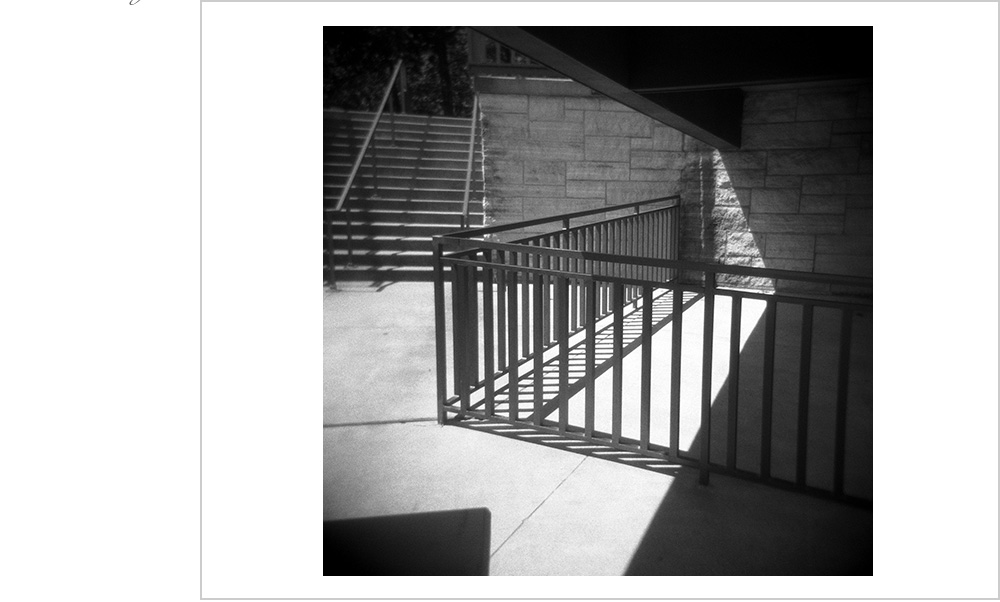 Give me stairs and railings, vertical lines and shadows, and I'll spin it into gold