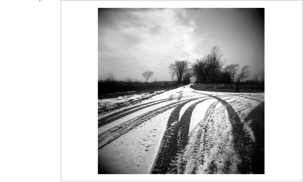 Lovely Wisconsin trees in the middle of winter. Snow on the ground, leading lines, clouds in the sky and me softly killing it