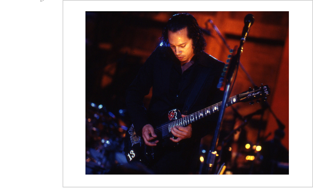 Kirk Hammett of Metallica levels up his guitar performing with the San Francisco Symphony at the Berkeley Community Theater