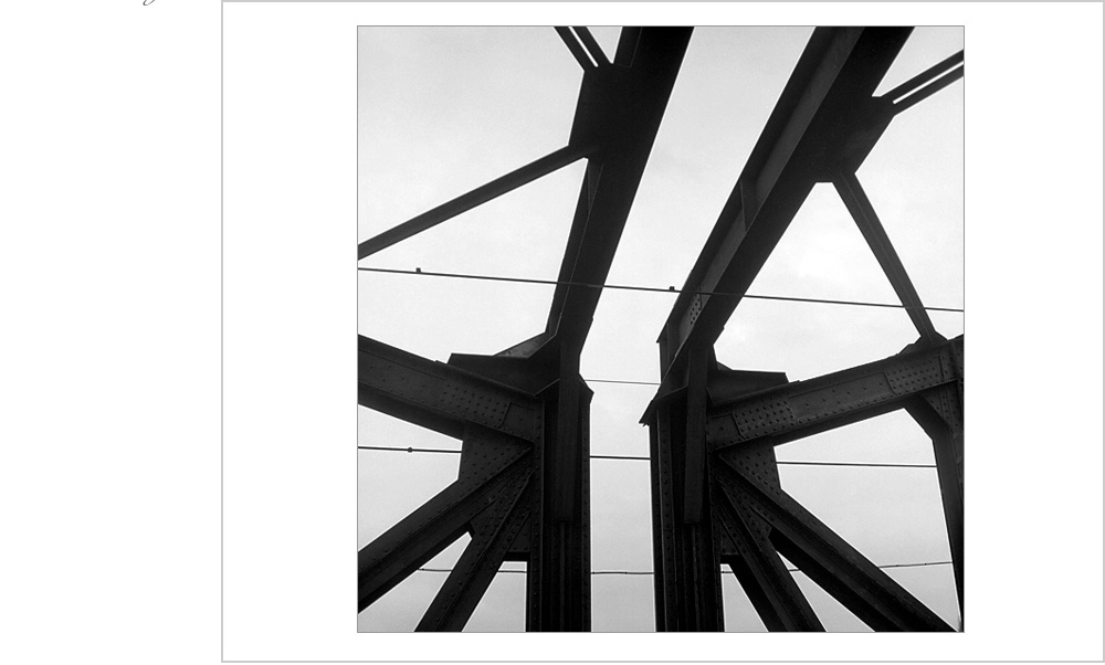 Strong diagonal lines and whimsical composition creates a visual treat for the eyes on this train trestle in Prague.