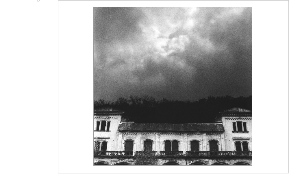 A face forms in the clouds, almost a clown's mask, materializing to look down in bemusement of the folley of man.